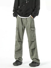 Men’s olive green full size wide leg cargo jeans with multiple large pockets and relaxed fit in leg cargo style