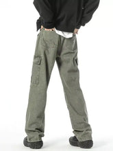 Men’s olive green cargo jeans with multiple pockets and a relaxed wide leg fit in plus size leg cargo style