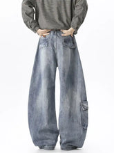 Men’s full size wide leg cargo jeans in faded blue denim with cargo pockets and a relaxed oversized fit