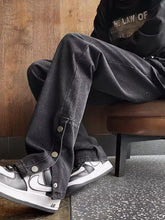 Men’s black denim wide-leg casual jeans with buttoned side slits and relaxed tapered fit for plus size comfort