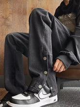 Black denim men’s full size wide-leg casual jeans with button closures on the side seam for comfortable wear