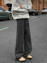 Men’s plus size black wide leg casual jeans with a relaxed straight cut and subtle front creases