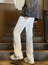 Men’s plus size white wide-leg casual jeans with subtle sheen and ankle zipper detail in full size