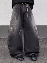 Men’s full size black wide leg distressed jeans in denim with faded wash and visible wear patterns plus size