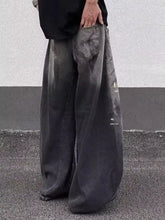 Men’s full size wide leg distressed dark gray denim jeans featuring a faded and leg distressed finish
