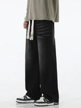 Men’s full size wide leg drawstring jeans in black distressed denim with white drawstring ties and wide leg design