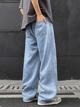Men’s full size wide leg drawstring jeans in light-wash denim with a relaxed fit and wide-leg cut front view