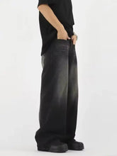 Men’s full size black wide leg denim jeans with a faded gradient wash and wide leg gradient design
