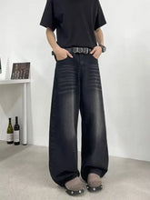 Men’s full size wide leg jeans in black denim with faded wash and subtle whiskering for a perfect fit