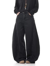 Men’s full size black wide leg jeans made from premium cotton with a relaxed oversized fit and visible stitching details
