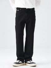Men’s full size wide leg jeans in black denim with straight leg and minimalist design featuring subtle stitching details