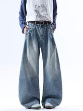 Men’s full size wide leg jeans in faded blue wash with relaxed fit and slightly stretchy fabric for comfort