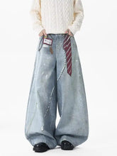 Men’s light-wash denim wide leg jeans with generous cut distressing and decorative stitching plus size full size