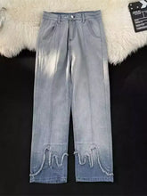 Men’s full size wide leg jeans in light-wash denim with decorative wavy frayed hems and a wide leg cut