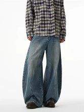 Men’s full size wide leg jeans in medium-wash blue denim with subtle fading and distressing details
