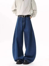 Men’s dark blue wide-leg jeans in denim with a relaxed fit and classic stitching size wide leg design