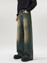 Men’s full size wide leg jeans in denim with a faded gradient wash from dark green to mustard yellow