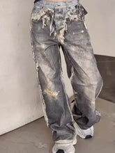 Men’s distressed gray denim wide leg jeans with frayed edges and intentional wear patterns plus size