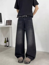Black wide leg denim jeans with faded distressed texture and subtle stitching offering a perfect fit in full sizes