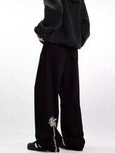 Men’s full size wide leg jeans in black featuring delicate silver palm tree embroidery along the outer seam