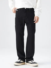 Men’s full size wide leg black denim jeans with white stitching and classic five-pocket design