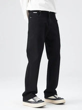 Men’s full size wide leg jeans in black denim with a clean minimalist design and subtle stitching details