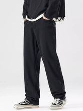 Men’s full size wide leg jeans in black cotton fabric with a relaxed fit and subtle side pockets