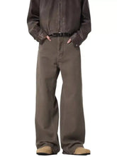 Brown men’s full size wide leg trousers with relaxed straight-cut silhouette and visible stitching details