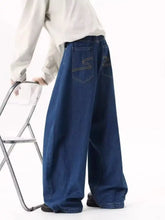 Men’s full size wide leg jeans in dark blue denim with stitched back pockets featuring a distinctive s-shaped logo