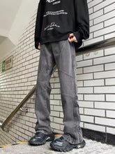Men’s full size wide leg jeans in dark gray distressed denim with visible stitching and side zipper details