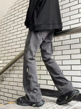Men’s dark gray wide leg jeans in denim with straight-leg cut and visible side seam zipper details