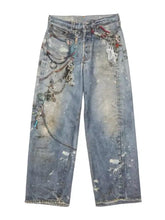 Men’s distressed blue denim full size wide leg jeans adorned with metallic chains keys and charms size wide leg