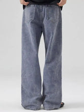 Men’s full size wide leg denim jeans plus size in faded blue wash with subtle distressing and visible stitching