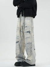 Men’s full size wide leg denim jeans with faded distressed look and gray white patches in plus size wide leg fit