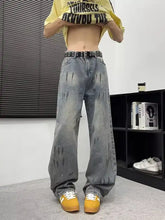 Men’s full size wide-leg jeans in faded gray wash denim with distressed paint-splatter design and size wide leg fit
