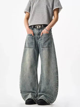 Men’s full size wide leg jeans in faded light blue denim with prominent front pockets and visible stitching