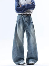 Men’s full size wide leg jeans in faded medium-blue denim with raw hem and slightly stretchy fabric for comfort