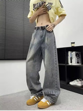 Men’s full size wide-leg gray denim jeans with a distressed faded look and subtle vertical stitching details