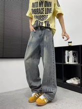 Men’s full size wide-leg jeans in gray distressed denim with faded look and subtle vertical stitching details