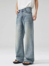 Men’s light-wash denim wide leg jeans with frayed hem designed for full size and plus size fit