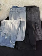 Men’s light-wash denim wide leg jeans with distressed frayed hem and decorative stitching detail plus size