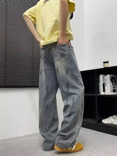 Men’s full size wide-leg jeans in light-wash denim with distressed and glittery texture for size wide leg fit