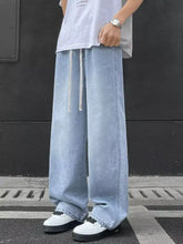 Men’s light-wash denim wide-leg jeans with a drawstring waistband in plus size for comfortable wear
