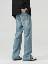Men’s full size wide leg jeans in light-wash denim with relaxed straight-leg cut and subtle fading for a modern look