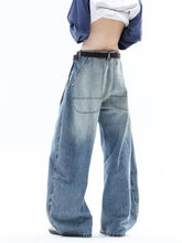 Men’s full size wide leg jeans in light-wash denim with relaxed fit front pockets and slightly stretchy fabric