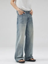 Men’s light-wash denim wide leg jeans with a relaxed straight cut and frayed hems in plus size full length