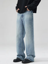 Men’s plus size light-wash denim wide-leg jeans with relaxed fit and subtle fading for a casual modern look