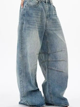 Men’s full size light-wash denim wide leg jeans with relaxed tapered fit and visible stitching details