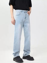 Men’s full size wide leg jeans in light-wash denim with straight-leg cut and classic five-pocket design