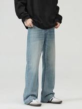 Men’s light-wash denim wide leg jeans with a straight-leg cut and faded detailing in full size plus size fit